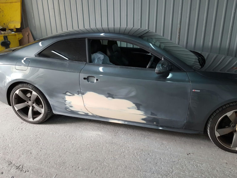 Door damaged and panel filled in on Audi A5